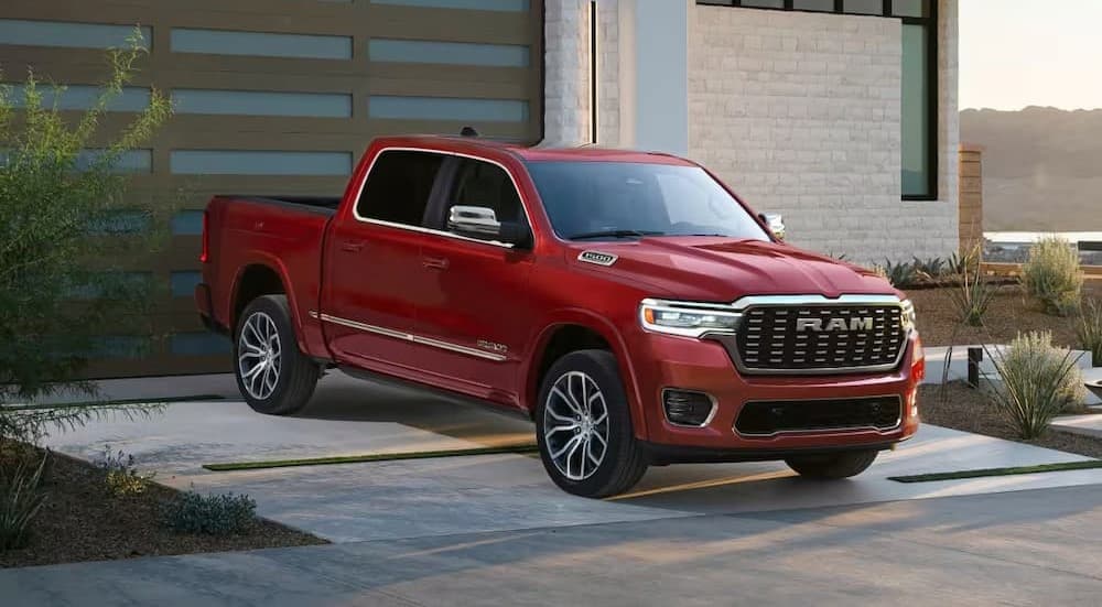 A red 2027 Ram 1500 parked on a driveway.