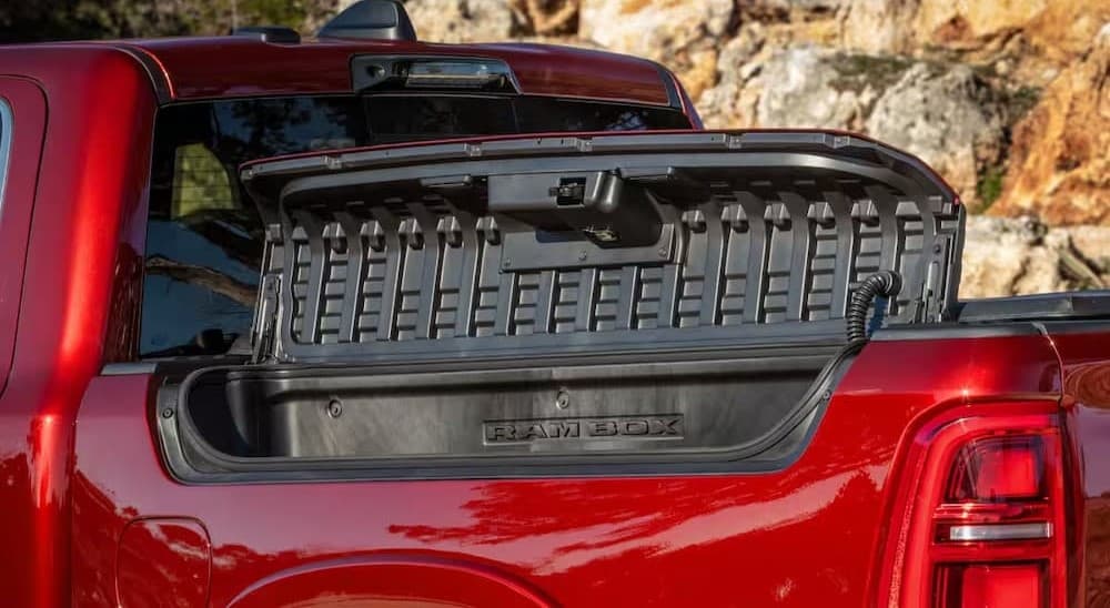Open Ram Box on a red 2027 Ram 1500.