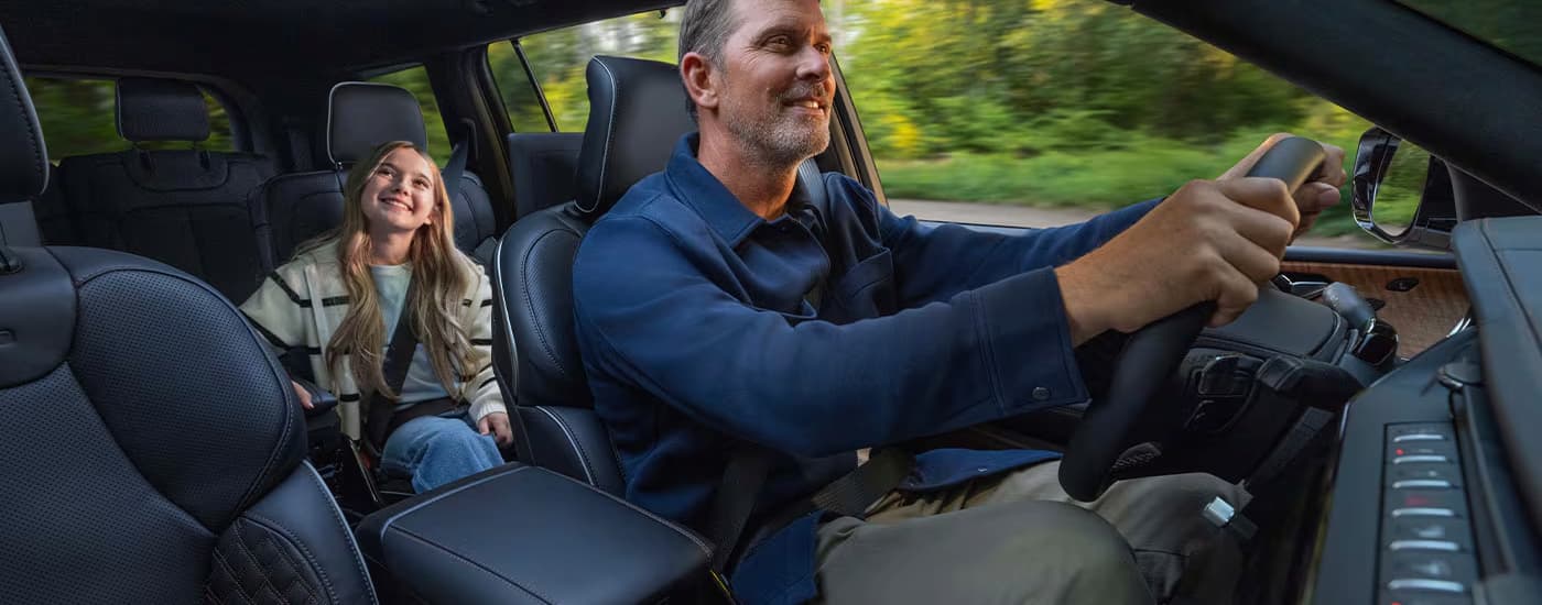 Family driving in a 2026 Jeep Grand Cherokee
