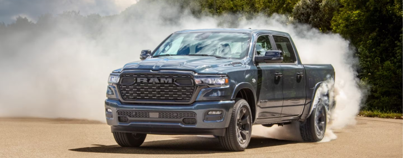 Blue 2026 Ram 1500 drifting off-road