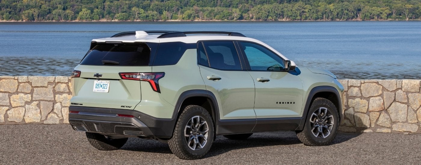 A green 2025 Chevy Equinox for sale from the rear at an angle.