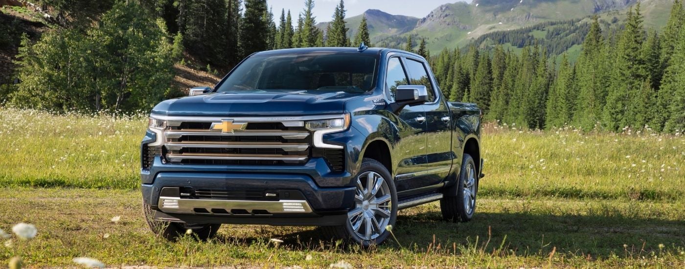A blue 2024 Chevy Silverado 1500 from the front at an angle.