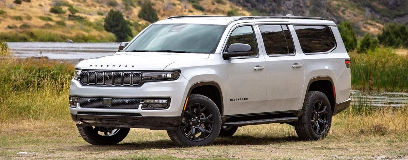 White 2025 Jeep Wagoneer parked near a lake