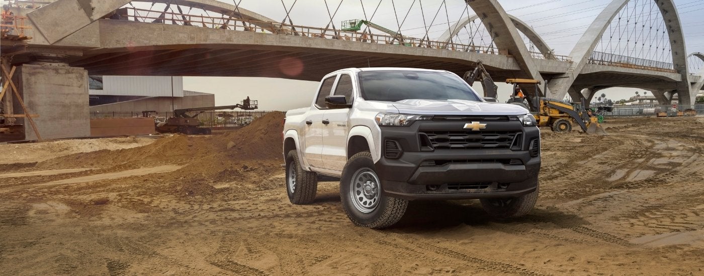 A white 2025 Chevy Colorado from the front at an angle after leaving a dealer that has work trucks for sale near Lexington.